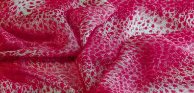 Beyaz kırmızı rengin dokusu, arkaplanı, deseni, ipek kumaşı tekstil. Özellikleri, daha esnek ve tasarlanması daha kolay olduğu için dokuma malzemesinden farklıdır..