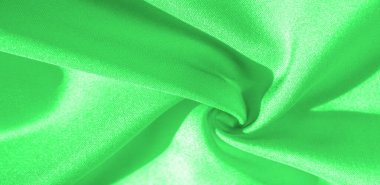 Yeşil renkli ipek kumaş. Bu ipek inanılmaz derecede zarif. Bundan yapılan projeler uzun süre devam edecek ve hala oldukça iyi durumda olacak.