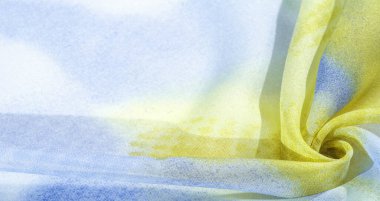 Yumuşak mavi, soyut desenleri ve yatak tonları olan ipek kumaş, sarı ve beyaz tonlarda. Doku, desen, koleksiyon