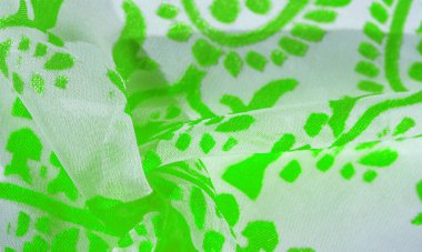 İpek kumaş, yeşil kumaş. Beyaz arka planda zarif çiçeklerin gölgeleri, Paisley 'nin fotoğrafı. Doku, desen, koleksiyon