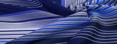 İpek kumaş, mavi arka plan, çizgili beyaz ve mor çizgiler, Meksika teması, Meksika pançosu kostümleri. Desen deseni, koleksiyon,