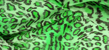 İpek kumaş yeşil, leopar desenli. Hafif leopar desenli ipek senin tasarımın için mükemmel, şık görünüyor ve kaba değil! Doku, arkaplan, desen