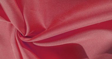 İpek kumaş yakut kırmızısıdır. Renkli ipek kumaşın dokusu arka plan olarak kullanılabilir