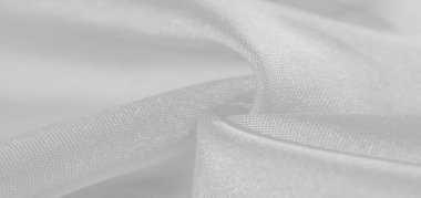 İpek beyazdır. Beyaz gri saten doku, gümüş kumaş, ipek panorama, arka plan, güzel yumuşak bulanık desenli. Doku, arkaplan deseni