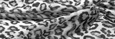 İpek kumaştan siyah beyaz leopar desenli. Leopar desenli hafif ipek senin tasarımına mükemmel uyacak, şık görünüyor ve kaba değil! Doku, arkaplan, desen