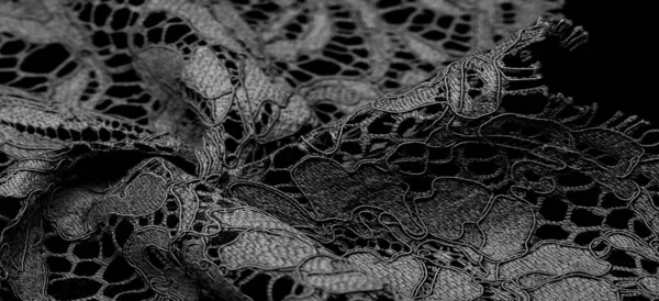 black lace fabric, delicate embossed lace fabric, scalloped on both edges. Suitable for your projects, design, etc. Texture, background