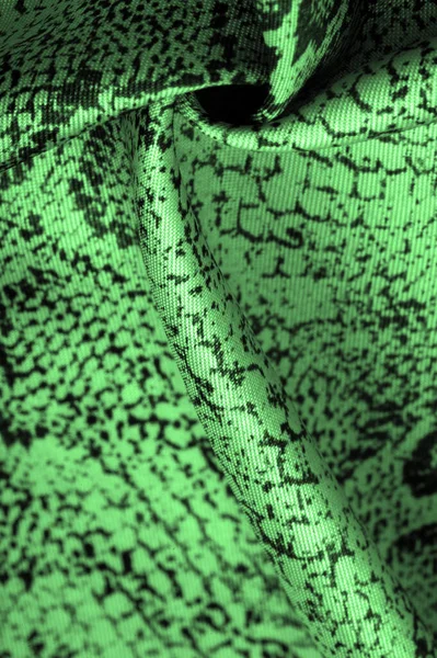 fabric with a green snake skin pattern, African fabric, designer photo - safari in the country of Africa. Texture, background