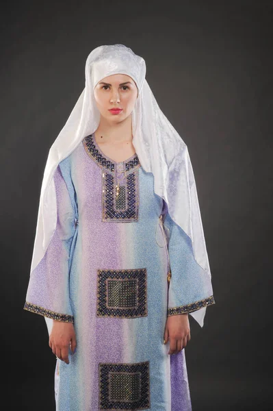 Model studio photo, Muslim clothing, the Arabic word hijab literally translated into English as \