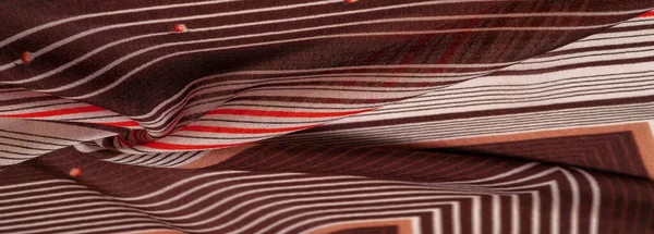 silk fabric, brown background with striped pattern of white and red lines, spanish theme, texture, pattern, collection