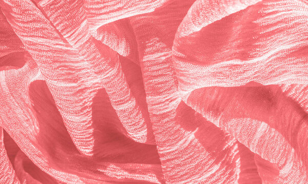 silk fabric. Texture of red wrinkled fabric. Red wrinkled fairy texture wavy surface, close-up, soft focus. background, pattern