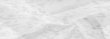 İpek kumaş, kar beyazı kumaş. Beyaz arka planda zarif çiçeklerin gölgeleri, Paisley 'nin fotoğrafı. Doku, desen, koleksiyon