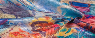 Boyalı bir palette ipek kumaş, soyut çizim, parlak renkler, kırmızı-sarı-mavi renk, sınırsız hayal gücü. doku, arkaplan, desen,