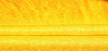 Parlak sarı madde. Bu ipek son derece pürüzsüz ve yumuşak, güzel pürüzsüz bir dokusu var. arkaplan deseni