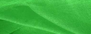 Parlak yeşil malzeme. Bu ipek son derece pürüzsüz ve yumuşak, güzel pürüzsüz bir dokusu var. arkaplan deseni