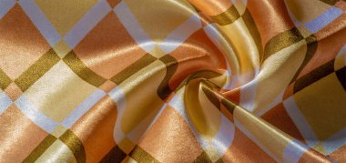 Kahverengi, sarı ve beyaz geometrik kare şekilli ipek kumaş. Soyut arkaplan, boş şablon. Basit geometrik desen, duvar kağıdı, doku, arkaplan.