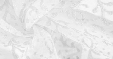 İpek kumaş, kar beyazı kumaş. Beyaz arka planda zarif çiçeklerin gölgeleri, Paisley 'nin fotoğrafı. Doku, desen, koleksiyon