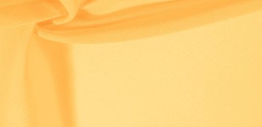 Sarı ipek kumaş. Tasarımlarınız, aksanlarınız, duvar kağıtlarınız, posterleriniz ve kartpostallarınız için mükemmel. doku arkaplan deseni.