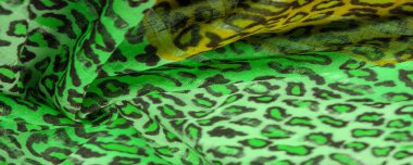 İpek kumaş yeşil, leopar desenli. Hafif leopar desenli ipek senin tasarımın için mükemmel, şık görünüyor ve kaba değil! Doku, arkaplan, desen