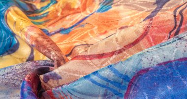 Boyalı bir palette ipek kumaş, soyut çizim, parlak renkler, kırmızı-sarı-mavi renk, sınırsız hayal gücü. doku, arkaplan, desen,