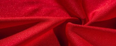Kırmızı ipek. Soyut bir arka plan olarak, lüks kırmızı ipeğin veya satenin dokusunu kullanabilirsiniz. Renkli doku, arkaplan, desen