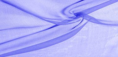 Mavi ipek kumaş dokusu. Pürüzsüz, zarif mavi ipekten ya da saten kumaştan. Lüks kumaş. soyut bir arkaplan olarak kullanılabilir.