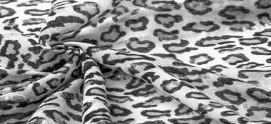 İpek kumaştan siyah beyaz leopar desenli. Leopar desenli hafif ipek senin tasarımına mükemmel uyacak, şık görünüyor ve kaba değil! Doku, arkaplan, desen