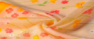 Doku arka planı, ipek kumaş, bej arka planda küçük çiçekler, ince dikiş. Kırmızı, bej renkli ton. Çiçek tasarımı