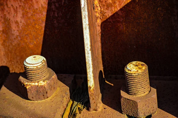 Rust on metal. Texture, background, pattern. When iron comes into contact with water and oxygen, it rusts. If salt is present, such as in seawater or salt spray, iron tends to rust more rapidly.