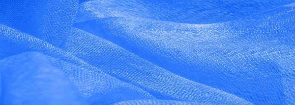 Parlak mavi malzeme. Bu ipek son derece pürüzsüz ve yumuşak, güzel pürüzsüz bir dokusu var. arkaplan deseni