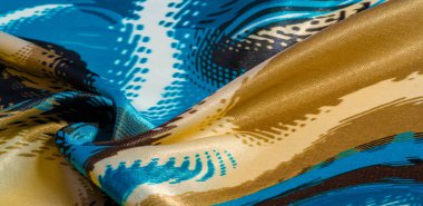 İpek kumaş. Renkler: Mavi, siyah, mor, bej. Doku, ipek panorama, arka plan güzel, yumuşak bulanık. Soyutlama