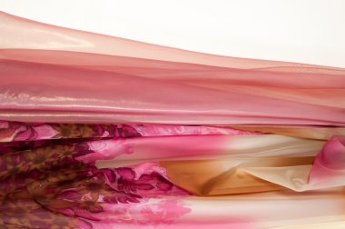 Pembe kumaş çiçek işlemeli. doku. Stüdyo fotoğrafı