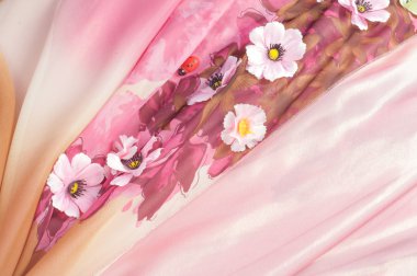 Pembe kumaş çiçek işlemeli. doku. Stüdyo fotoğrafı