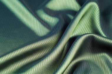 Yeşil çizgili kumaş. doku. mavi ve sarı spektrum ile arasında renk renkli çimen veya zümrüt gibi.