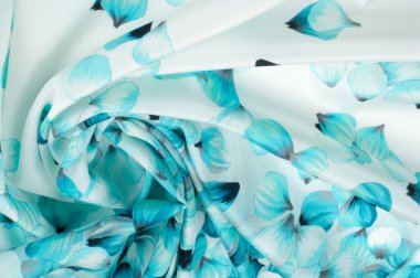  İpek kumaş dokusu. mavi çiçekler