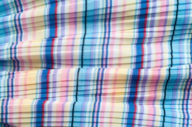 Pileli kumaş. Sinii sarı kırmızı beyaz çizgili doku