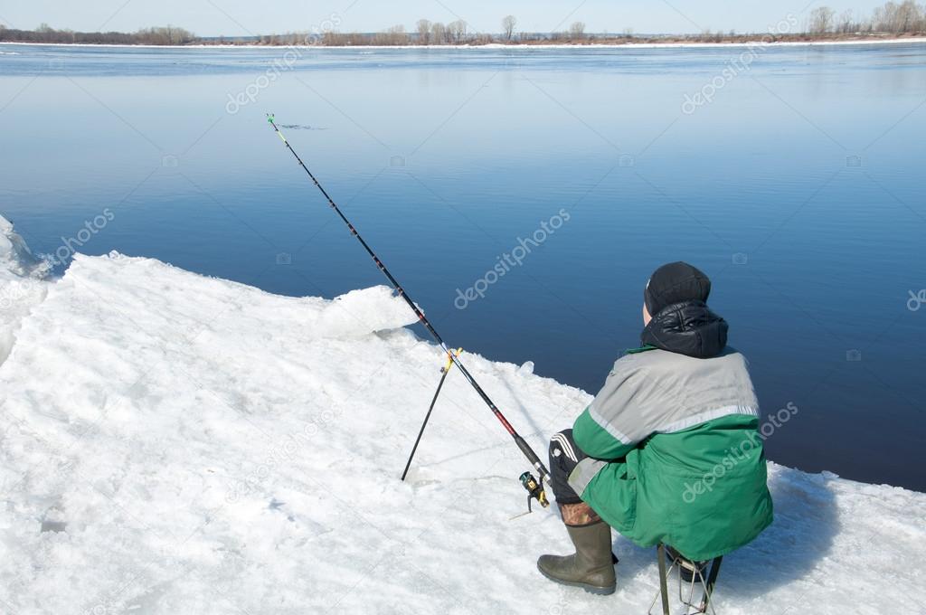River flood fishermen. Torn river ice fishermen. River with the 