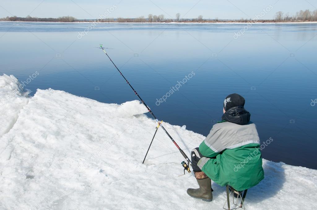 River flood fishermen. Torn river ice fishermen. River with the 