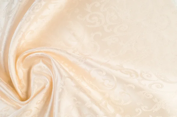 Ткань шелковая текстура, кремовая, бледно-бежевая — стоковое фото