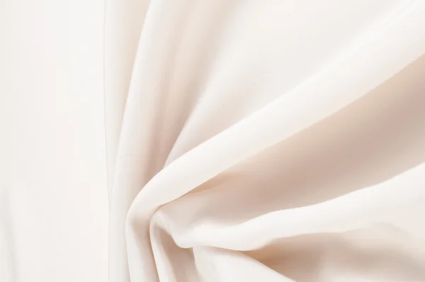 Ткань шелковая текстура, кремовая, бледно-бежевая — стоковое фото