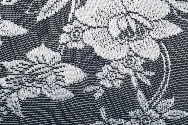 Doku dantel kumaş. dantel beyaz arka plan stüdyo üzerinde. ince kumaş iplik veya iş parçacığı yapılmış. genellikle bir pamuk veya ipek, döngü, büküm veya desenleri iplik örgü tarafından yapılmıştır