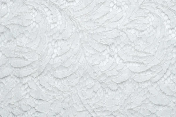 Texture lace fabric. lace on white background studio. thin fabric made of yarn or thread. typically one of cotton or silk, made by looping, twisting, or knitting thread in patterns