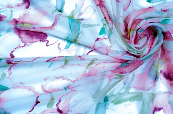 花の描かれたシルクの手触りの生地 — ストック写真