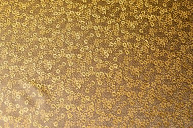 İpek kumaş doku, renk ışık sarı altın başak, küçük çiçekli. moda tasarım zemin için küçük çiçek süsleme desenli kumaş.