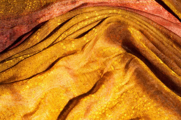 The texture of wool fabric yellow red golden — Stock Photo, Image