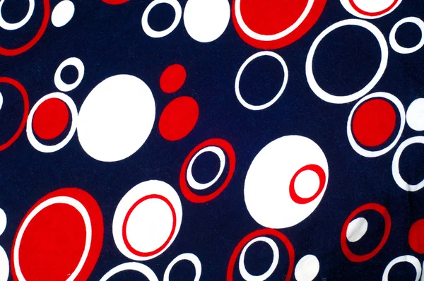 A textura do tecido de malha com círculos azuis pintados A re — Fotografia de Stock