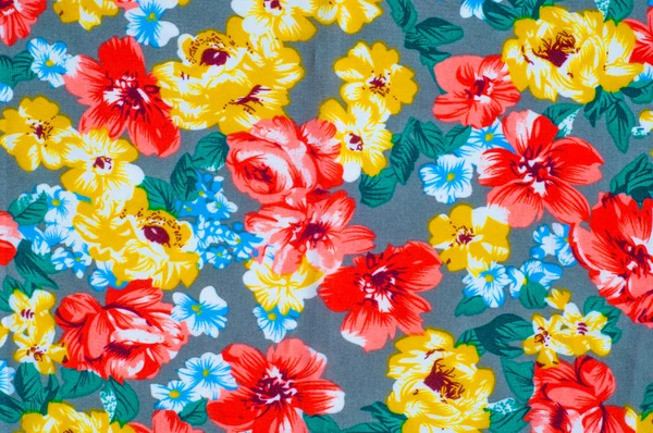 Texture silk cloth. Yellow red flowers painted on cloth — Stock Photo, Image