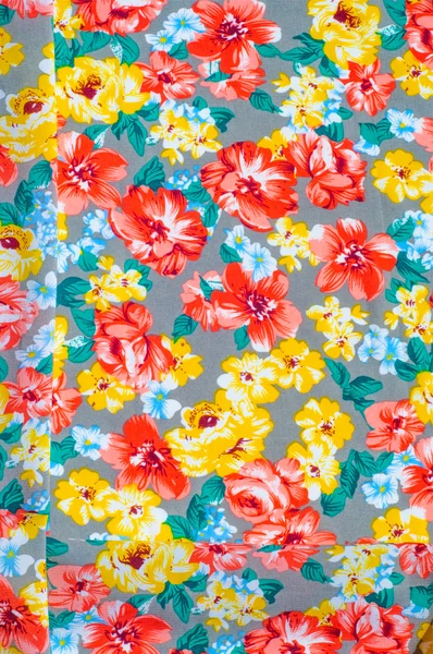 Texture silk cloth. Yellow red flowers painted on cloth — Stock Photo, Image