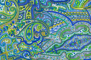 doku bir soyut desen, mavi sarı beyaz yeşil deseni ipek kumaş. iyi, güçlü, yumuşak, parlak elyaf koza yapımında silkworms tarafından üretilen ve iplik ve kumaş yapmak için toplanan.