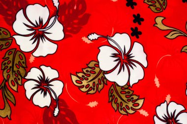 Pamuk kumaş dokusu, arka plan, kırmızı zemin üzerine beyaz çiçekler boyanmış. tropikal ve subtropikal bitki tohumları çevreleyen yumuşak beyaz lifli madde