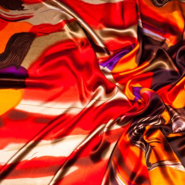 Kumaş renk soyutlama, bir desenle sarı, kırmızı. Fotoğraf stüdyosu